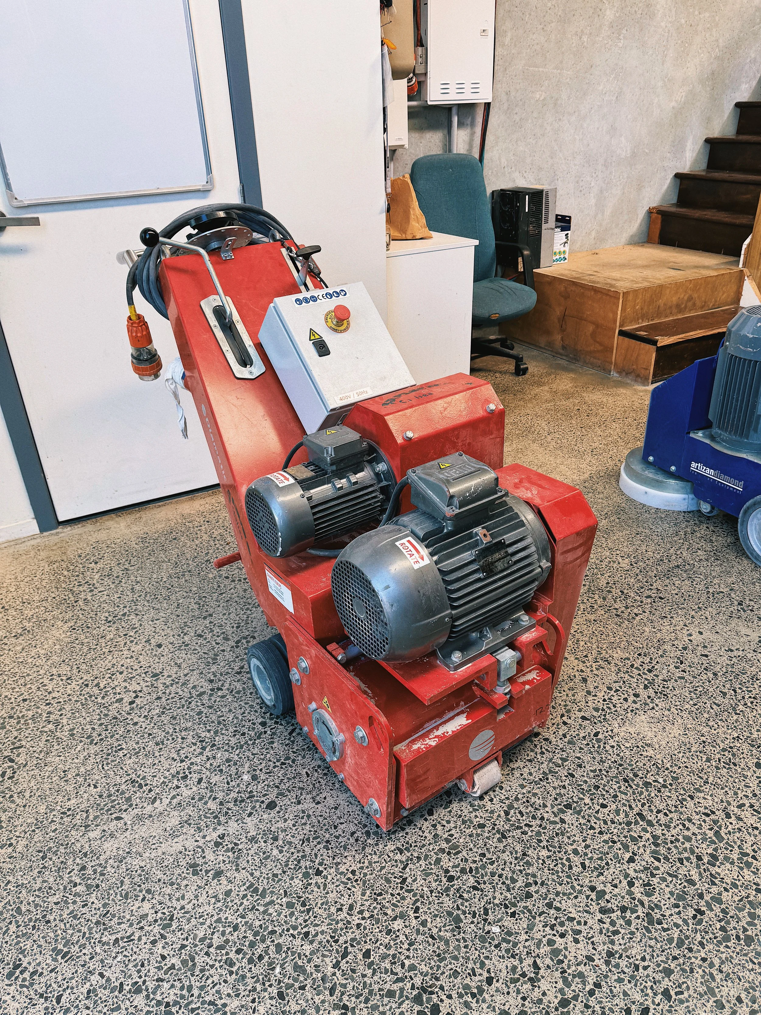 Concrete shaver preparing a floor.